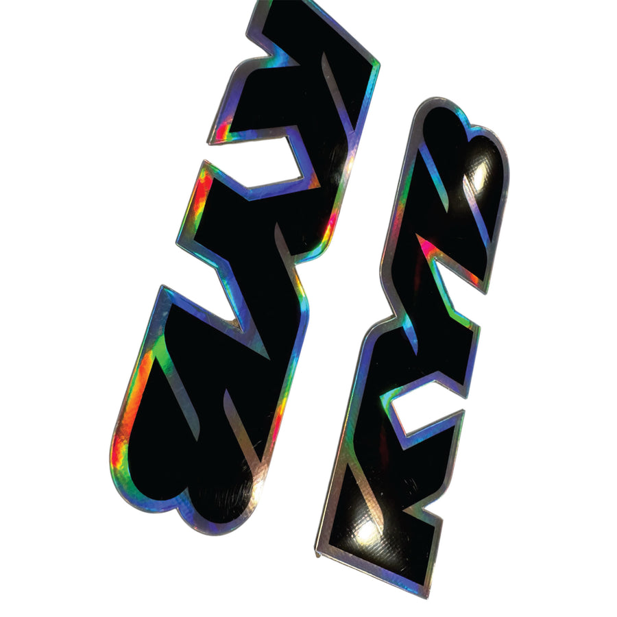 Holographic black and rainbow letter 'A' on a white background